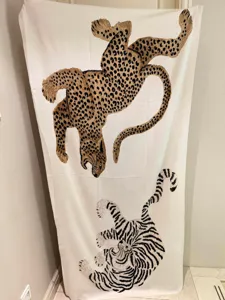 Detailed view of vintage style leopard and tiger print shawl, elegant fashion fabric accessory.
