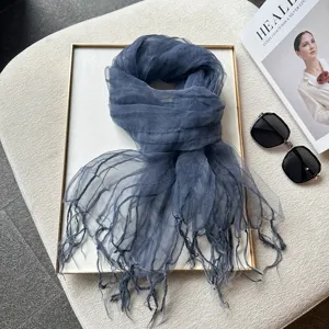 Blue textured organza fringe scarf detail, lightweight spring summer fashion accessory.