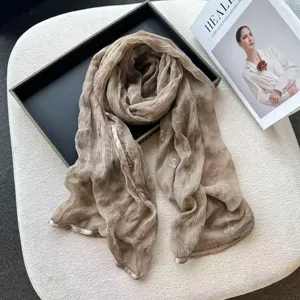 Chic lightweight bow print silk scarf detail, soft breathable fabric, elegant spring fashion shawl.