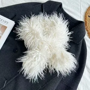 Detailed shot of a white faux Tibetan lamb curly fur scarf, thick plush winter neckerchief.