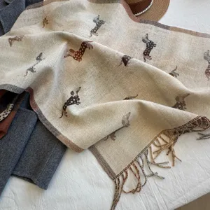 Soft faux cashmere scarf featuring cute dog jacquard patterns and elegant fringes.