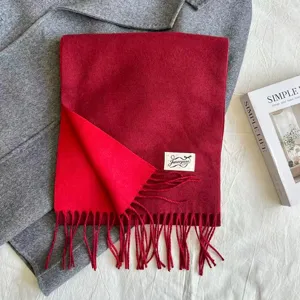 Red imitation cashmere tassel scarf detail, soft warm winter neck wrap, elegant daily wear.