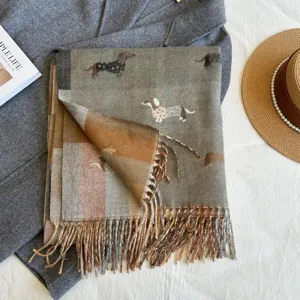 Detailed view of the cute dachshund jacquard imitation cashmere scarf with tassels.
