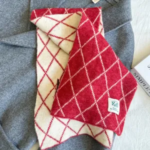 Red and white diamond knit scarf detail, soft woolen texture, cozy winter accessory.