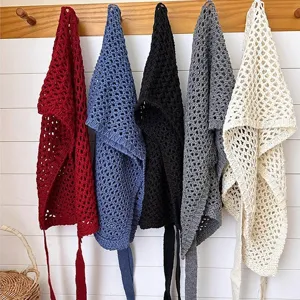 Detailed view of hollow knit triangular scarf waist accessory in multiple color variants.