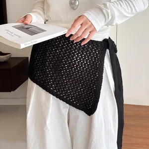 Detail view of Korean style hollow knit square scarf waist belt layering fashion accessory.