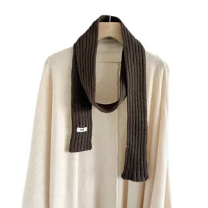 Dark brown ribbed knit scarf for women, trendy narrow long winter neck warmer accessory.