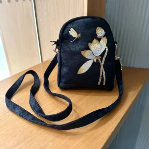 Chinese style black embroidered lotus crossbody bag for women, elegant vintage shoulder bag.