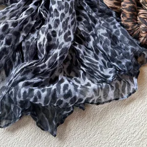 Grey black leopard print pleated scarf detail, lightweight soft fabric, autumn winter fashion accessory.