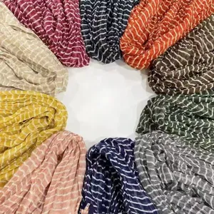 Detailed view of women's pleated striped long scarves in multiple vibrant colors, stylish.