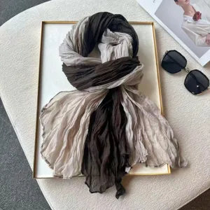 Detail shot of fashion pleated gradient color block scarf, stylish autumn winter decorative shawl.