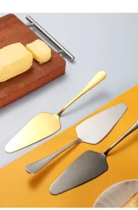 Stainless steel cake server set with serrated edge in gold, silver, and black for baking.