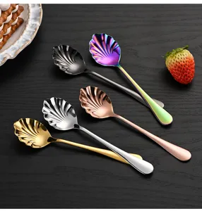 Stainless steel shell-shaped spoons in assorted colors for dessert, coffee, and cake details.