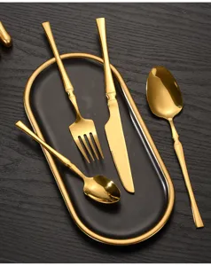 Luxury gold stainless steel cutlery set with elegant waist design, tableware detail view.