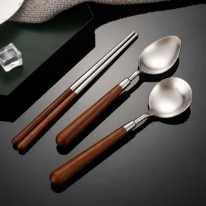 Stainless steel and walnut wood cutlery set with chopsticks and spoons, Japanese style for home.