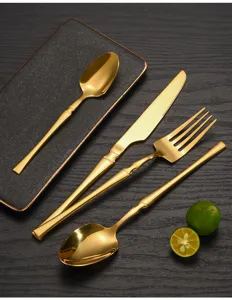 Gold stainless steel flatware set detail view showing luxury waist cutlery design 4-piece