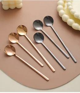 Stainless steel long handled round spoons detail view, elegant coffee spoons and dessert stirrers.