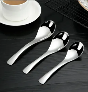 Stainless steel spoon detail showing polished finish, smooth edges and deep bowl design.