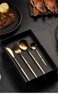 Detail shot of elegant golden stainless steel cutlery set showcasing exquisite craftsmanship and finish.