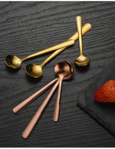Detailed shot of 304 stainless steel short-handle round spoons in gold and rose gold.