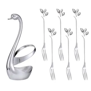 Stainless steel swan holder with six leaf fruit forks set, elegant kitchen tableware display.