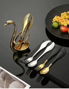 Stainless steel swan holder set with creative angel wing dessert spoons and fruit forks for kitchen.
