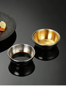 Stainless steel dipping sauce dish detail, dual-color interior, perfect for hot pot condiments.