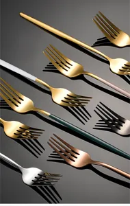 Stainless steel fork detail shot, multi-color flatware set, premium kitchen dining cutlery.