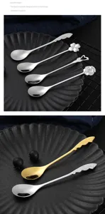 Stainless steel dessert spoon detail, creative rose and clover coffee stirring spoon design.