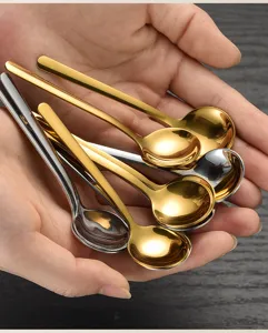 Mini stainless steel round spoons in gold and silver, ideal for coffee or dessert use.