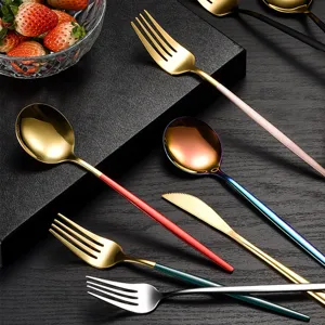 Stainless steel cutlery set with colorful handles, elegant fork spoon knife for dining.