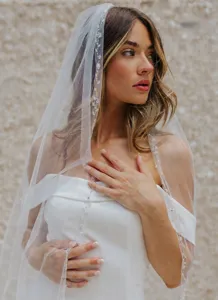 Exquisite handmade beaded lace bridal veil, elegant single-layer wedding hair accessory for women.