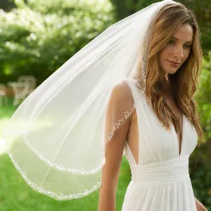 Details of the handmade beaded lace bridal veil, perfect for wedding ceremonies and photoshoots.