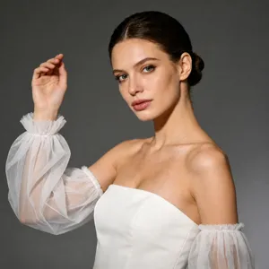 Detail view of elegant bridal pleated tulle puff sleeves wedding dress accessory white mesh.