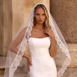 Detail shot of floral lace edge bridal veil, elegant Mantilla veil for wedding ceremony.