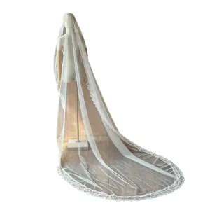 Elegant long bridal wedding veil with delicate lace trim for classic bride style.