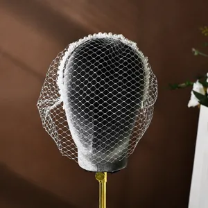 Velo gabbia uccelli perla sposa cerchietto rete bianca accessorio capelli matrimonio elegante.