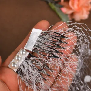 Pearl mesh hair comb bridal veil detail shot, elegant vintage hair accessory for wedding.