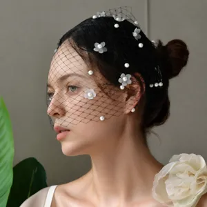Vintage black mesh bridal veil hair comb with delicate pearls and floral decorations for women
