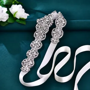 Stunning bridal rhinestone belt detail, sparkling crystal pearl applique on white satin.