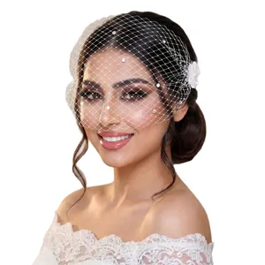 Stunning bridal birdcage veil with sparkling rhinestones, perfect for wedding parties and events.
