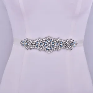Exquisite handmade bridal rhinestone belt with blue pearls and ribbon for wedding dress detail.