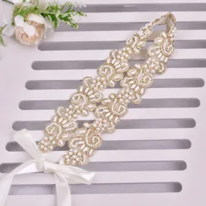 Handmade bridal pearl belt with white satin bow, elegant gold embroidery sash for wedding dress.