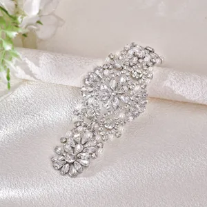 Bridal rhinestone sash belt featuring sparkling crystals and pearls for wedding dress decoration.