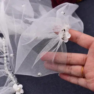 Bridal tulle cape detail white mesh wedding shawl with pearls and sweet floral clip accessories