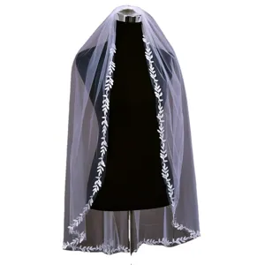 Elegant white bridal veil with delicate leaf lace embroidery, perfect for fairy and lawn weddings.