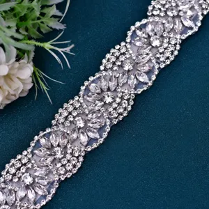 Exquisite rhinestone belt detail shot, sparkling crystal applique for wedding bridal gown decor.