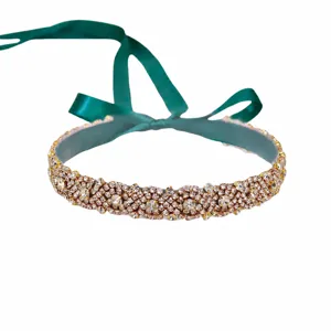 Bridal rhinestone belt with dark green ribbon, sparkling crystal wedding dress sash accessory.
