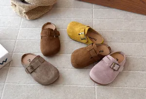 Detailed view of retro suede slip-on clogs with metal buckle, soft sole, casual indoor outdoor footwear.