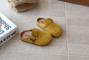 Retro suede children closed toe clogs slip on sandals in yellow minimalist detail view
